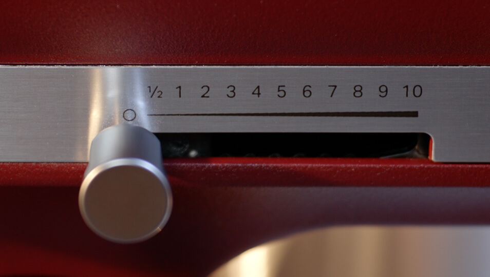 A person twisting the speed control knob.