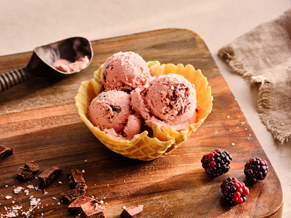 Scoops of ice cream in a waffle cone bowl