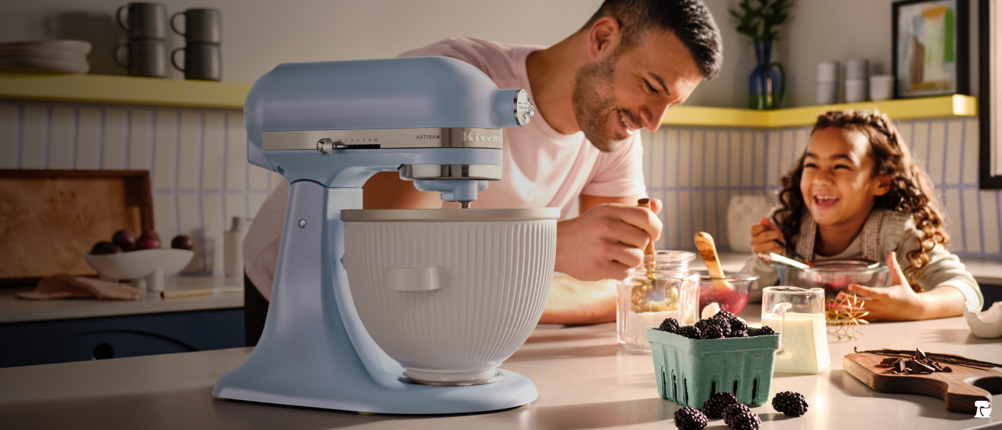 A father and child making recipes with a KitchenAid® Stand Mixer
