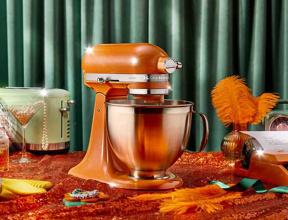 A KitchenAid® stand mixer in Tangerine Twinkle.