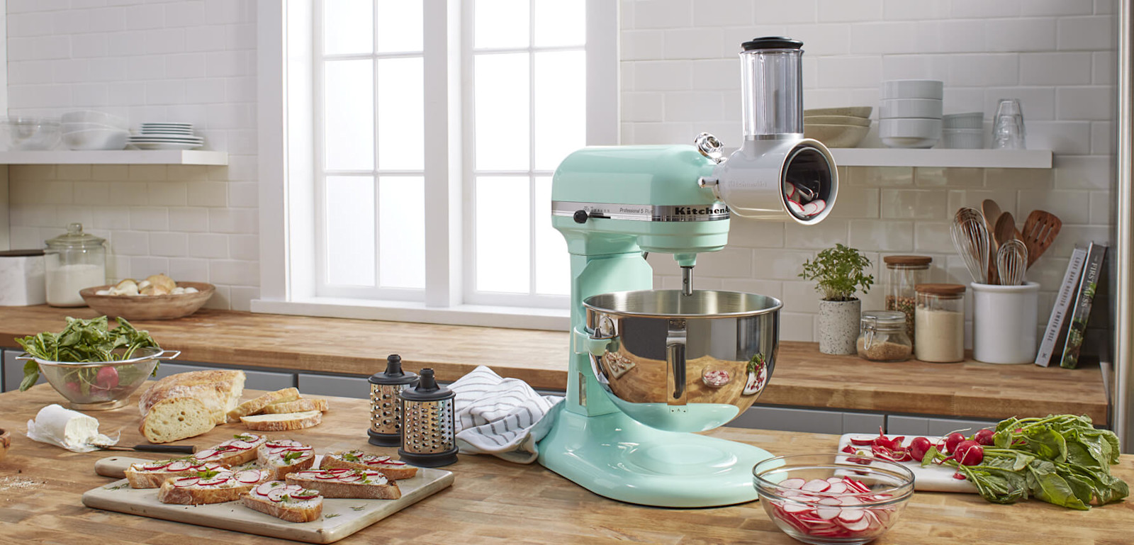 A KitchenAid stand mixer with food processor attachment