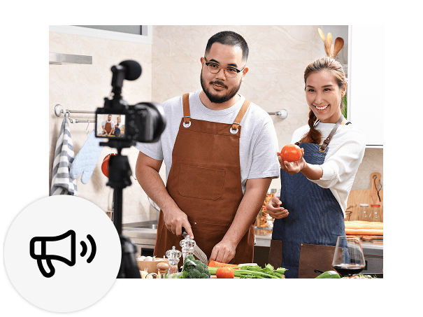 Two people recording themselves cooking