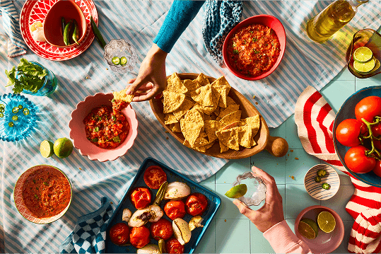 Salsa and chips on a table