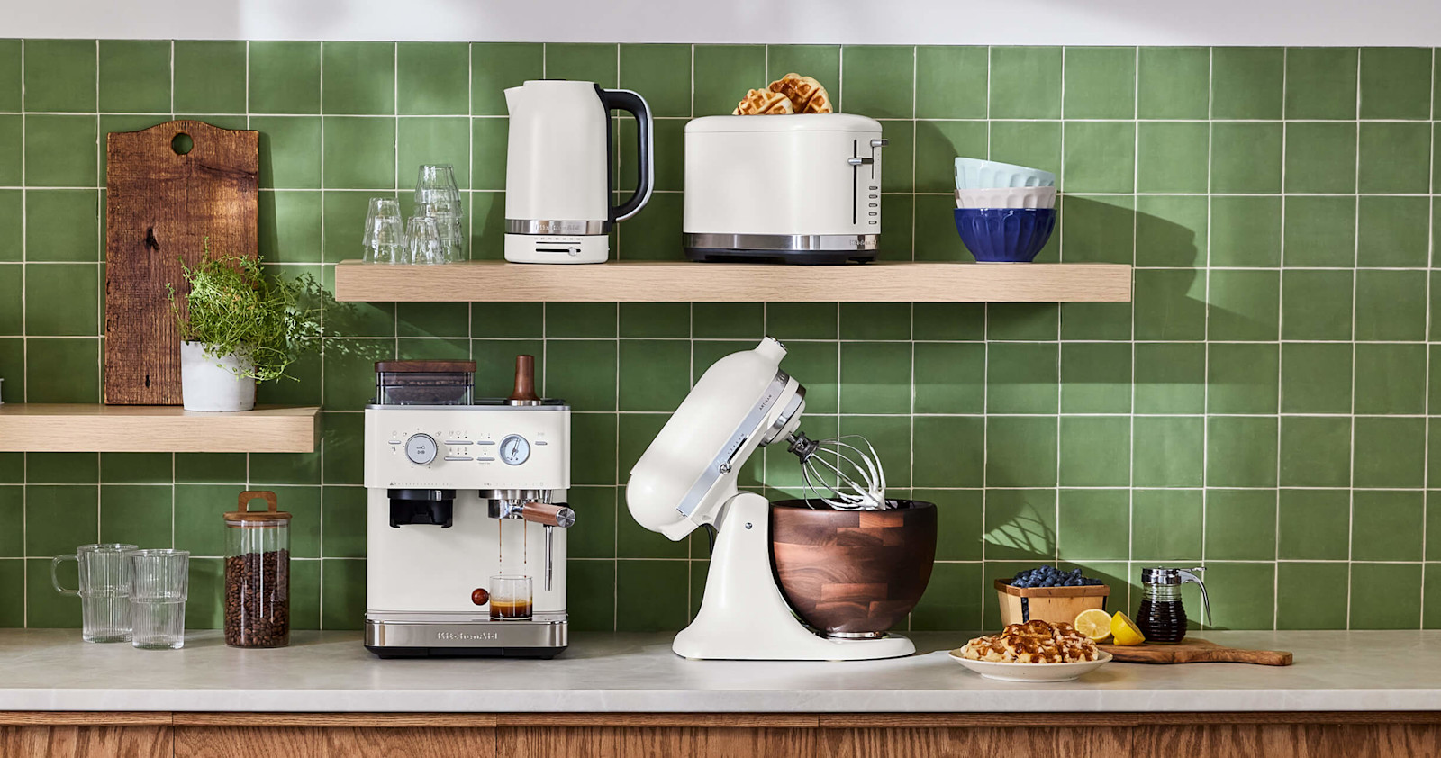 A collection of white KitchenAid® countertop appliances