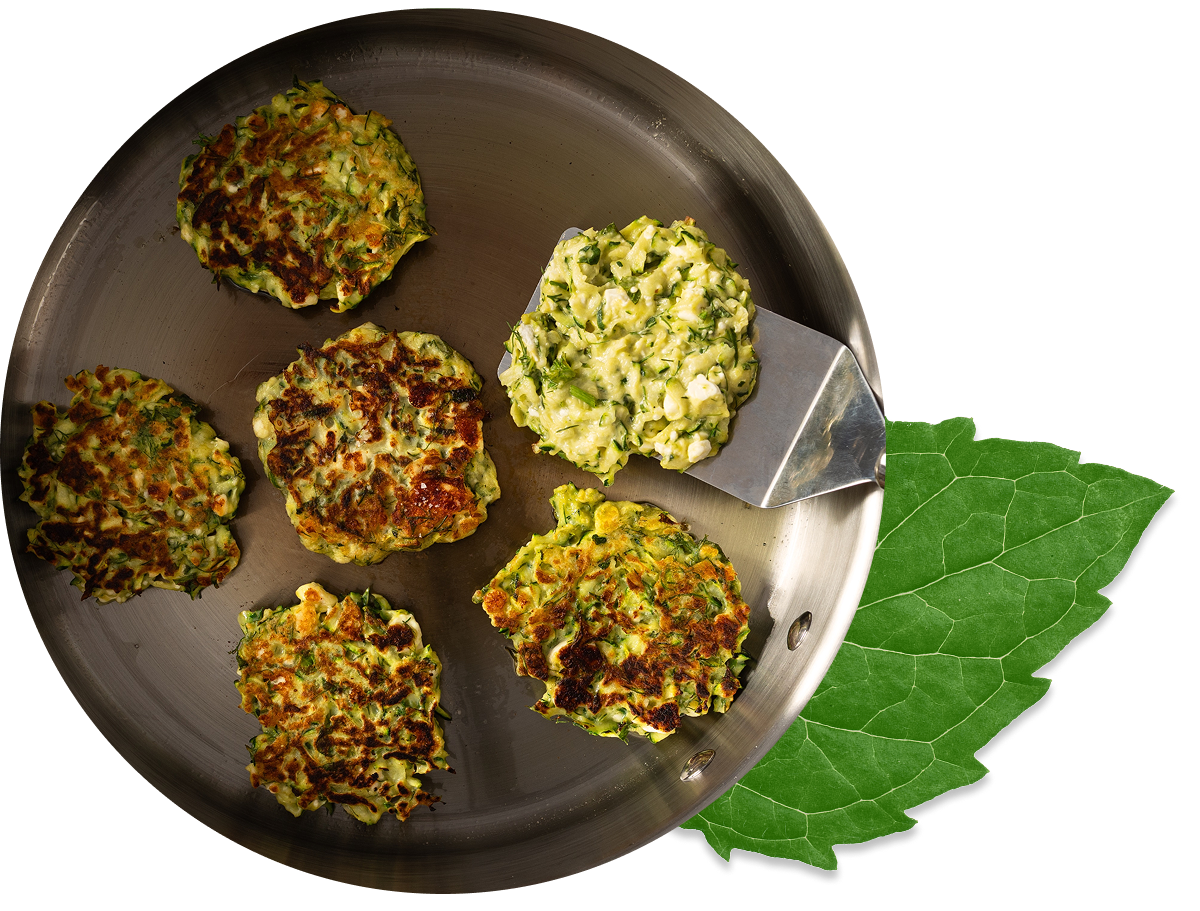 Zucchini fritters in a saute pan.