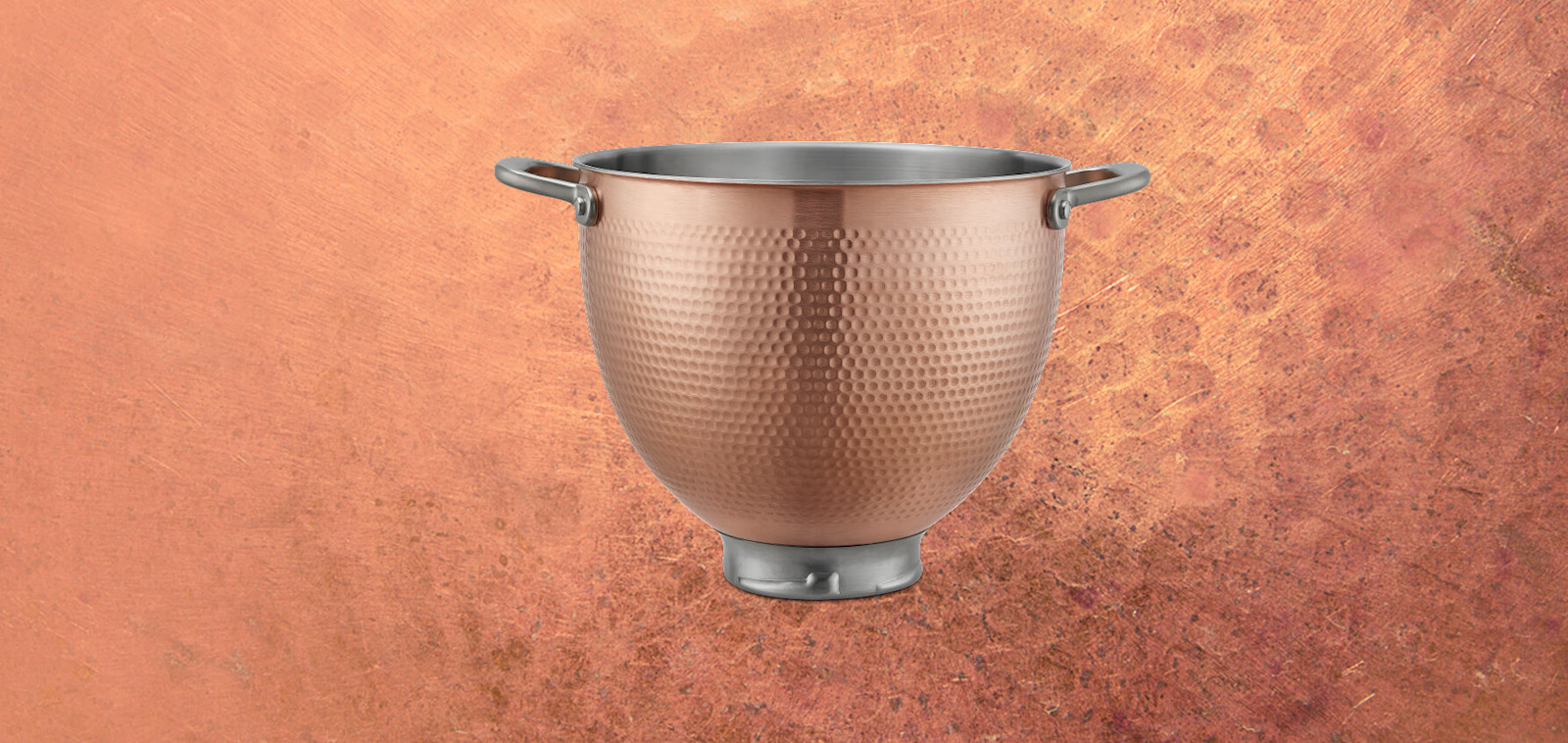 Hammered copper KitchenAid® stand mixer bowl on a copper-toned background