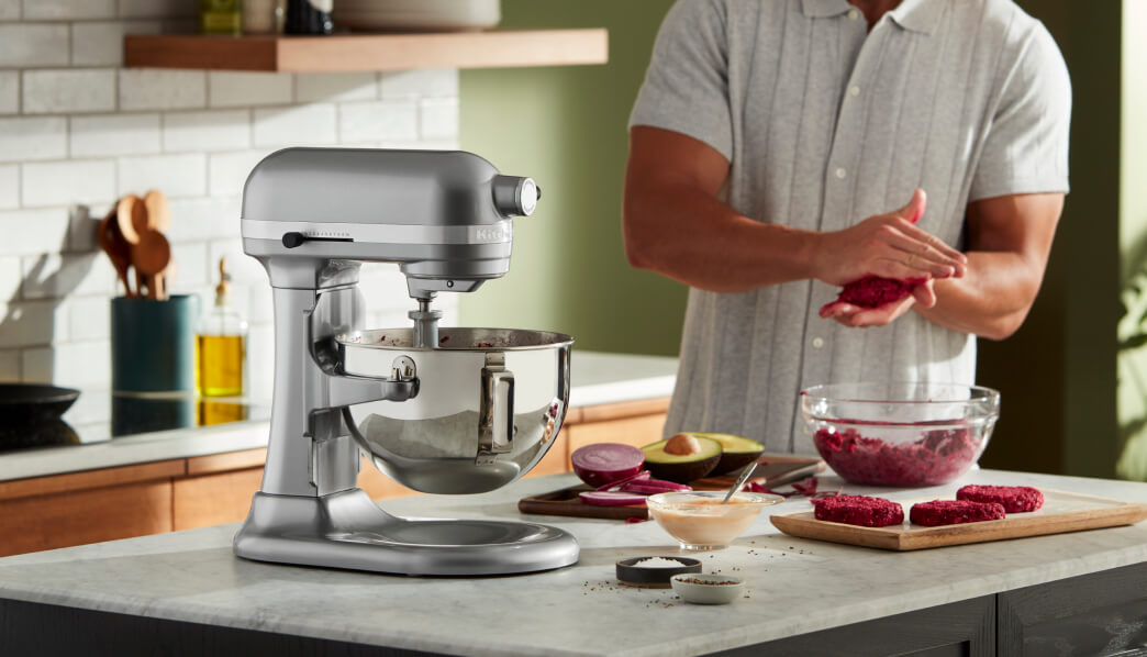 Silver KitchenAid® bowl-lift stand mixer on counter with prepped ingredients