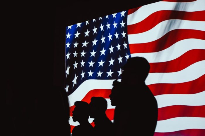 silhouette-of-people-beside-usa-flag-1046399-700x466
