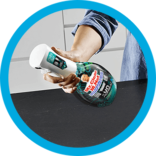 A person cleaning a kitchen countertop with CleanFreak Unstopables