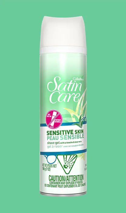 Gillette Venus Satin Care Sensitive Skin shaving gel can on a green background.