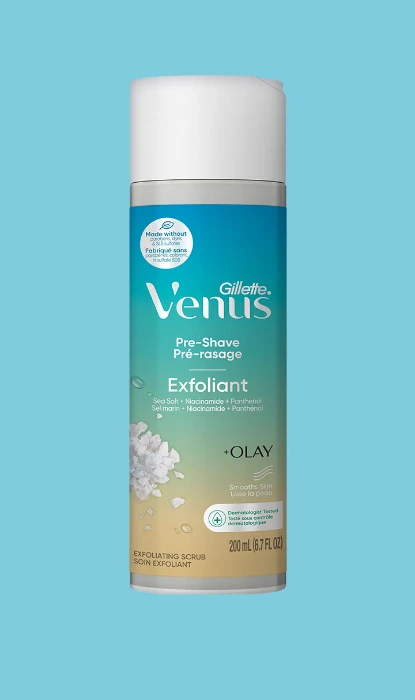 Venus Pre-Shave Sea Salt Scrub bottle on a blue background