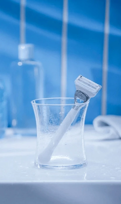 Gillette VenusPubic razor placed in the glass