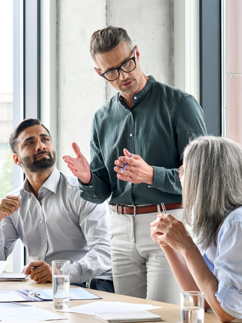 Three advisors meet to discuss hiring an associate advisor and creating an equity ownership structure.