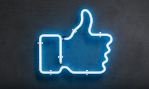 Thumbs up icon as a blue neon light