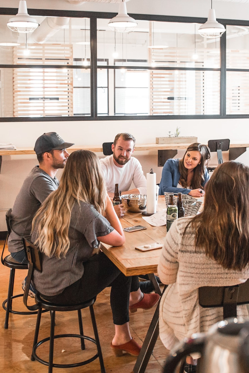 Employees enjoy lunch together in the break room.