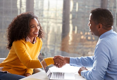 Man and woman sitting together having a meeting.