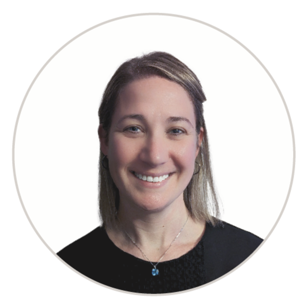 Portrait of a woman smiling, wearing a black shirt against a white background