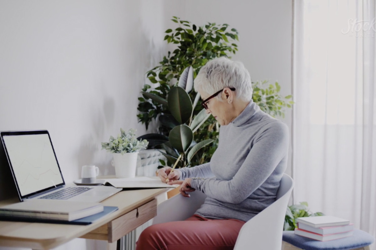 Woman sitting at a desk.