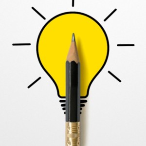 An illuminated lightbulb drawing with a small black pencil placed over it