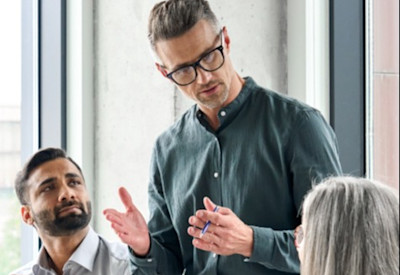 Three advisors meet to discuss hiring an associate advisor and creating an equity ownership structure.