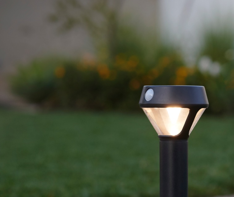 Solar Pathlight shown outdoors with blurred background.
