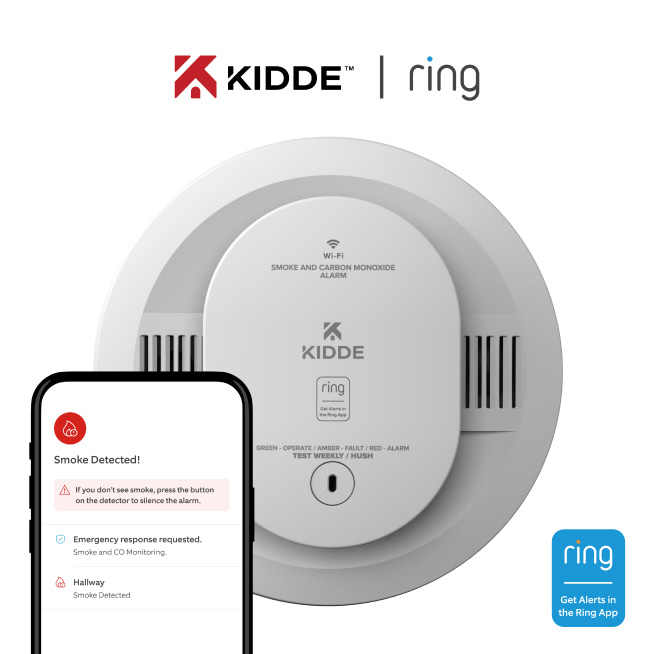 A Kidde Smoke and CO detector sits behind a smartphone showing a Smoke Detected alert in the Ring app, with emergency response options.