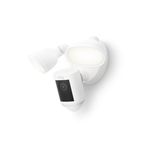 A white Floodlight Cam Wired Pro with dual LED floodlights, built-in security camera, and circular mounting base.