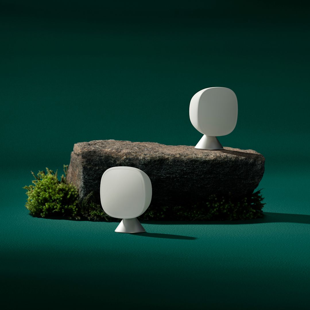 2 ecobee smart sensors on a green background