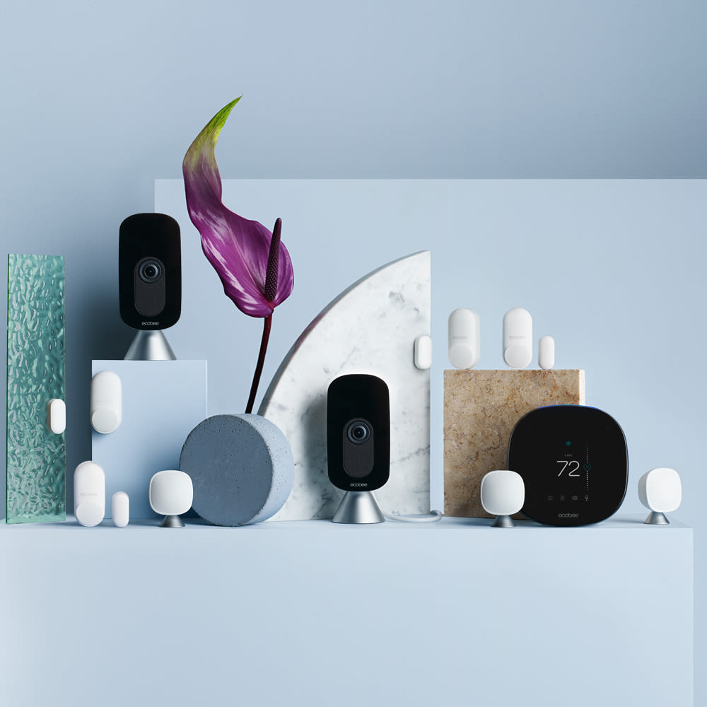 SmartThermostat with voice control and 3 SmartSensors floating on a pink background.