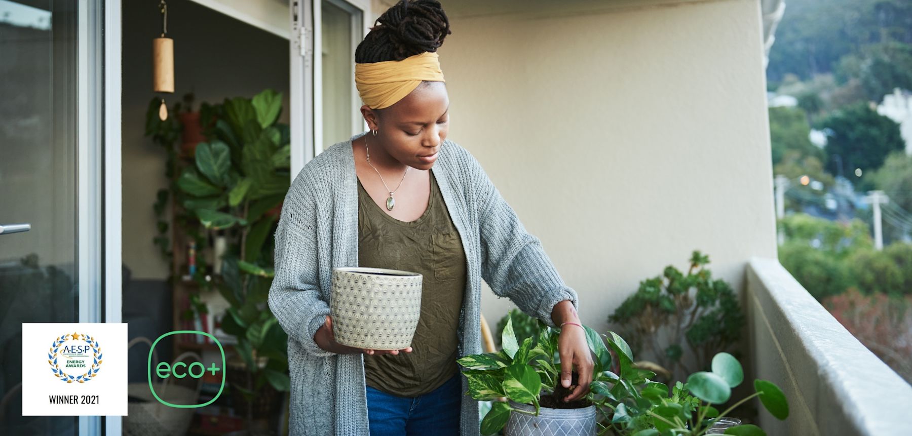 Image of woman watering plants.
