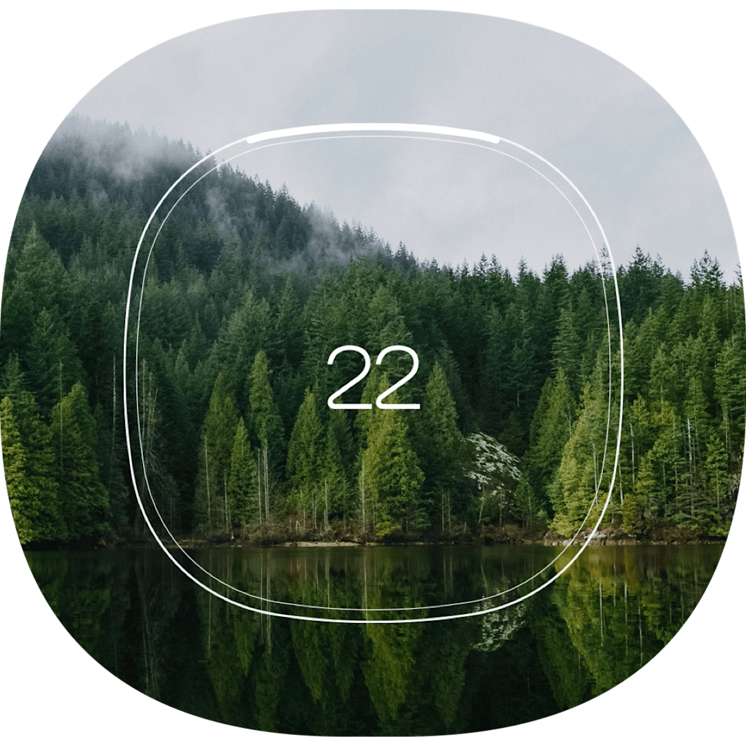 A thermostat shape over an image of a forest.