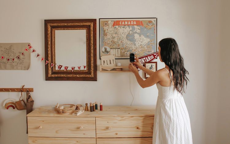 A woman sets up her ecobee SmartCamera