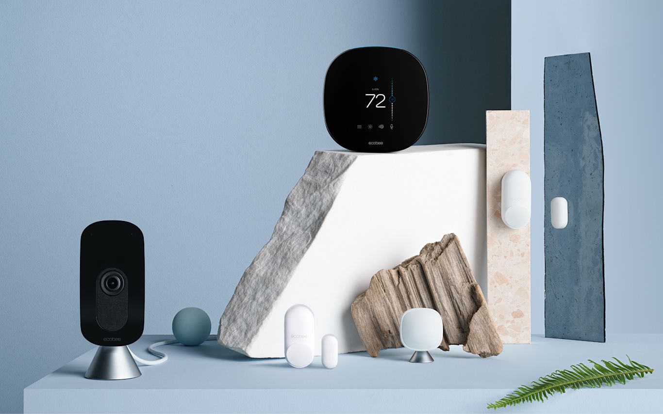 ecobee SmartCamera, SmartThermostat with voice control, and sensors on a blue background.