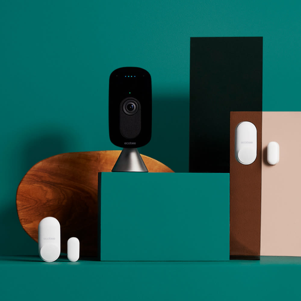 The ecobee Essential Home Security Bundle on a green background.