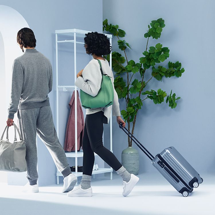 Couple leaving on vacation, trusting their smart home security while away.