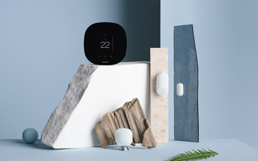 Smart Thermostat with Whole Home Sensors on a blue background