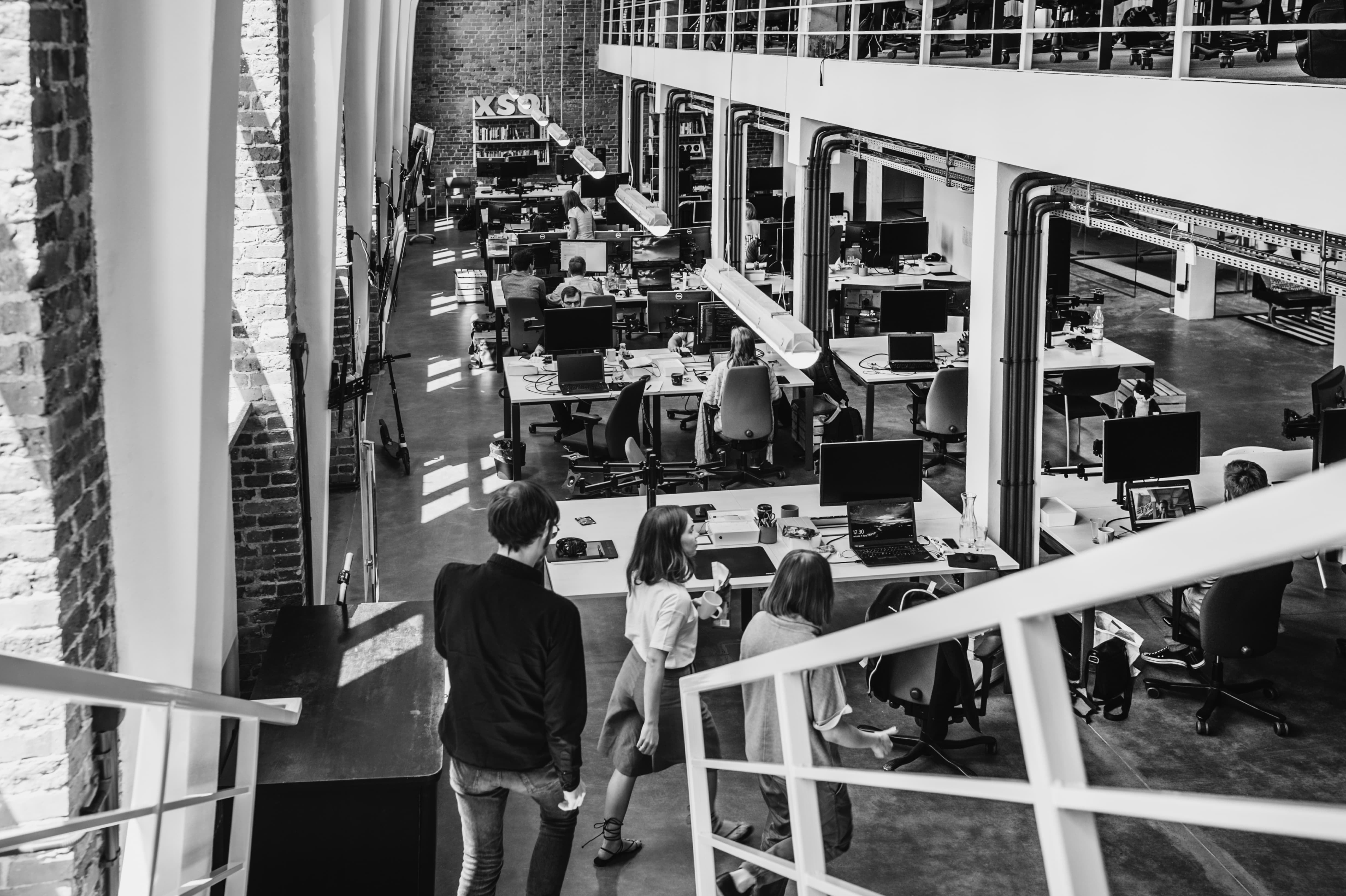 People walking through the office