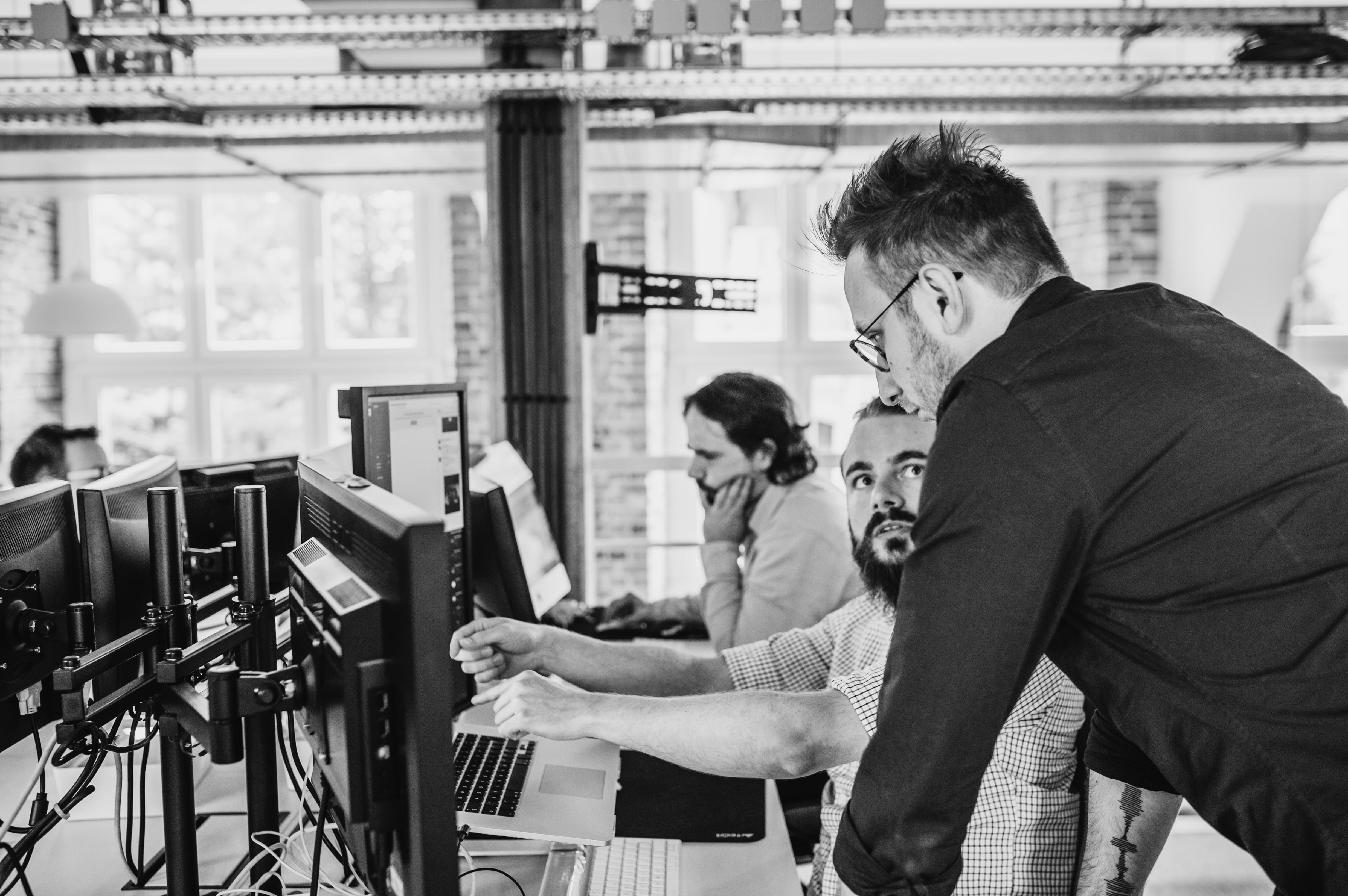 Man Explains something to Colleague