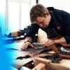 Image of man measuring and cutting leather- square.