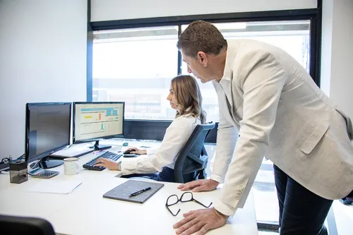 walsh-accountants-man-and-woman-looking-at-monitor