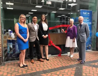 Explore Learning staff stood outside the Watford centre as local dignitaries cut the ribbon to symbolise the opening of the centre. 