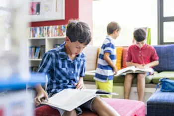 Children reading in a Explore Centre