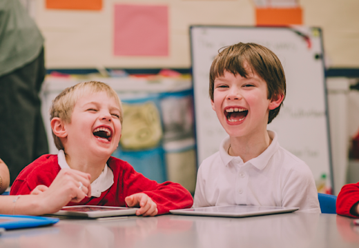 Friends laughing in school