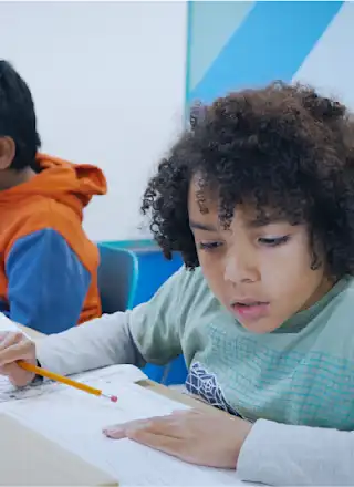 A child studying for their 11 Plus exam at an Explore Learning centre