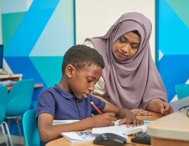 Tutor working with a KS2 child