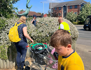 Harry and volunteers picking up rubbish from their local area.
