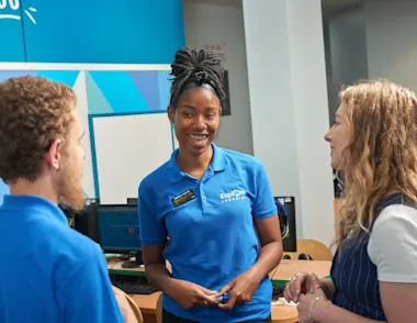 Two tutors speak with a manager