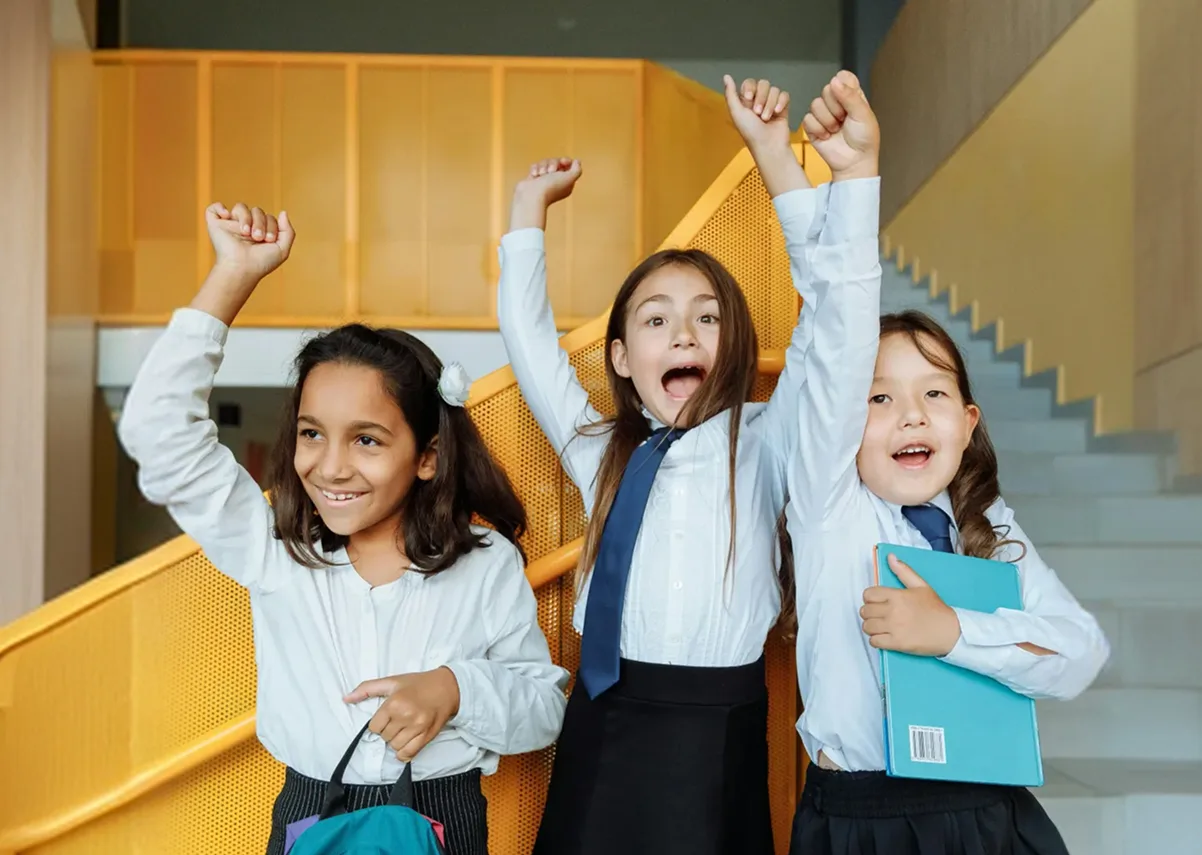 Happy school kids celebrating success