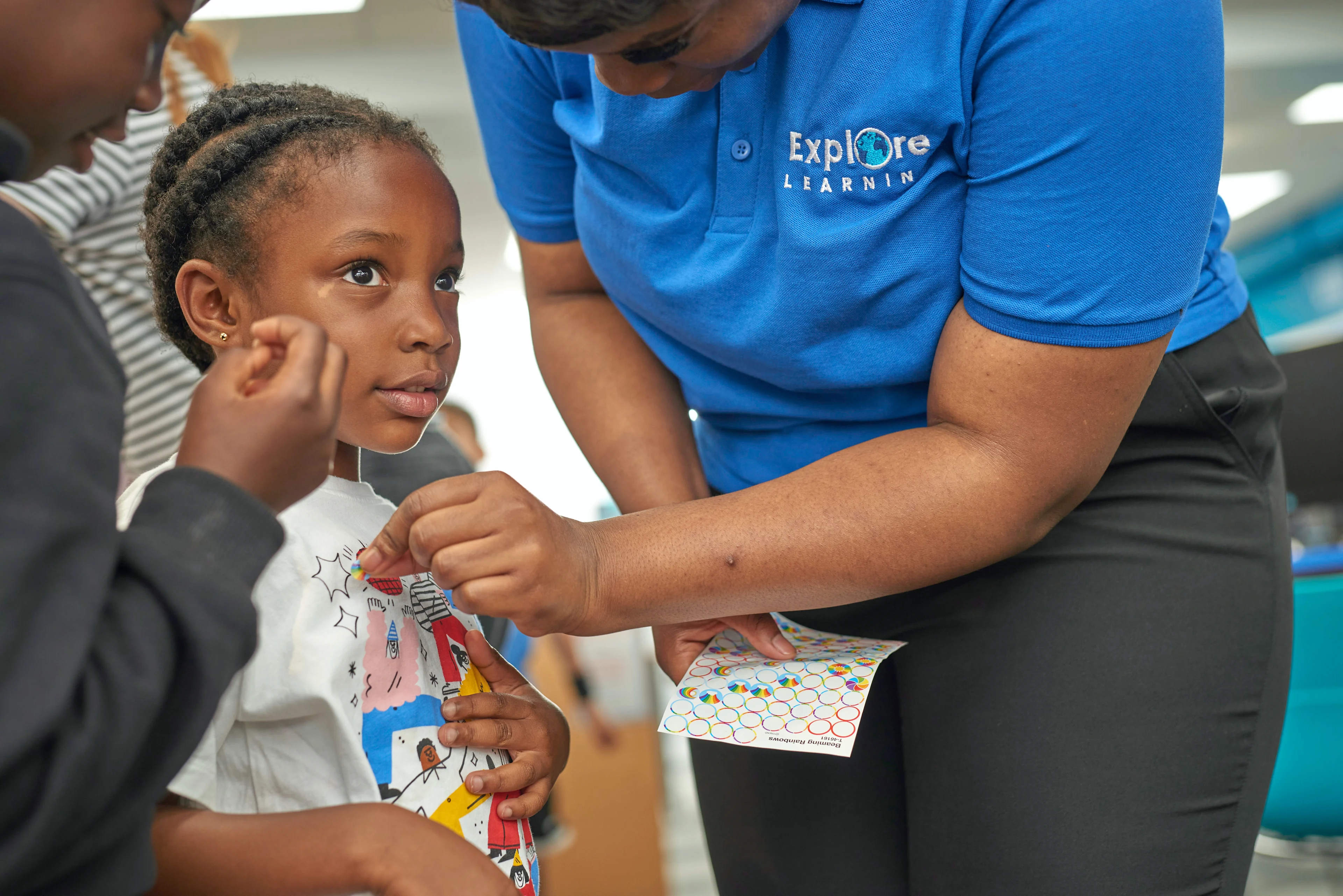 Child receiving a sticker at an Explore Learning tuition centre