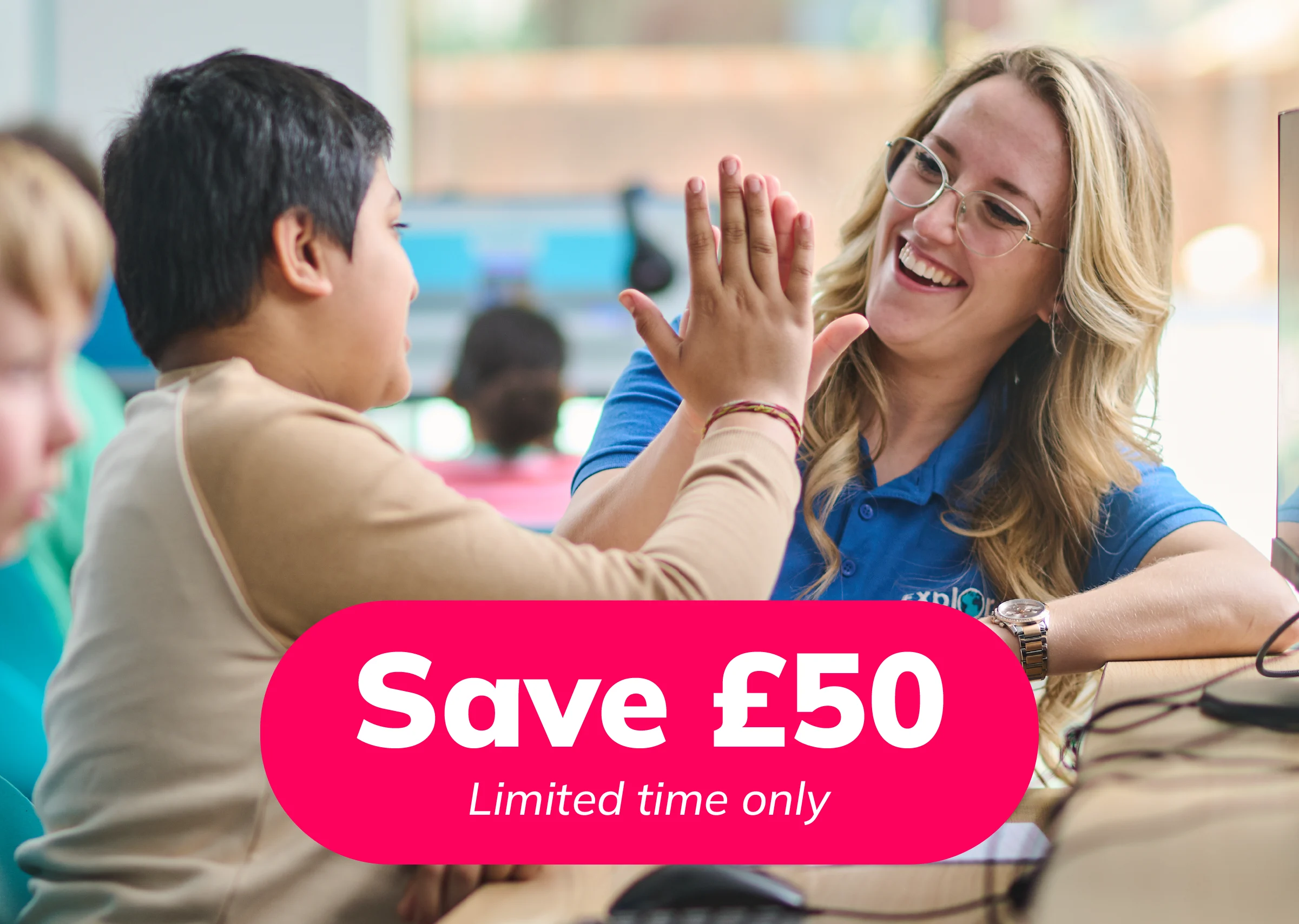 Tutor high-fiving child in an Explore Learning centre with a promotional save £50 badge